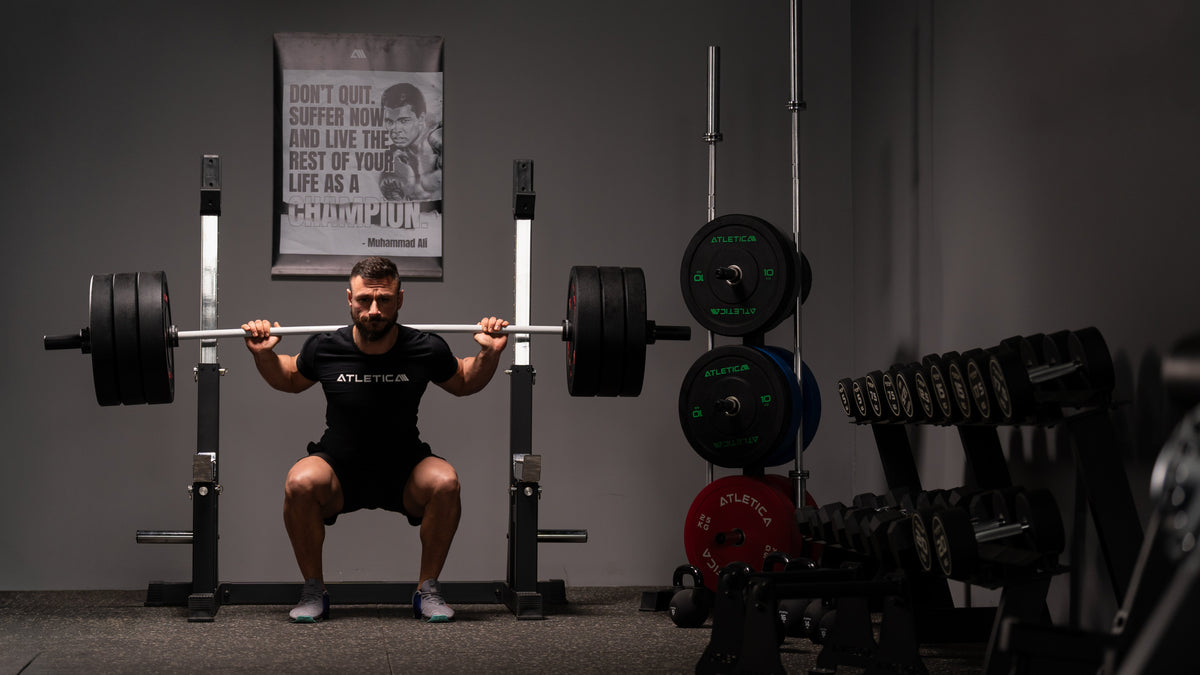 Squatting in the Atletica squat rack in a Garage Gym