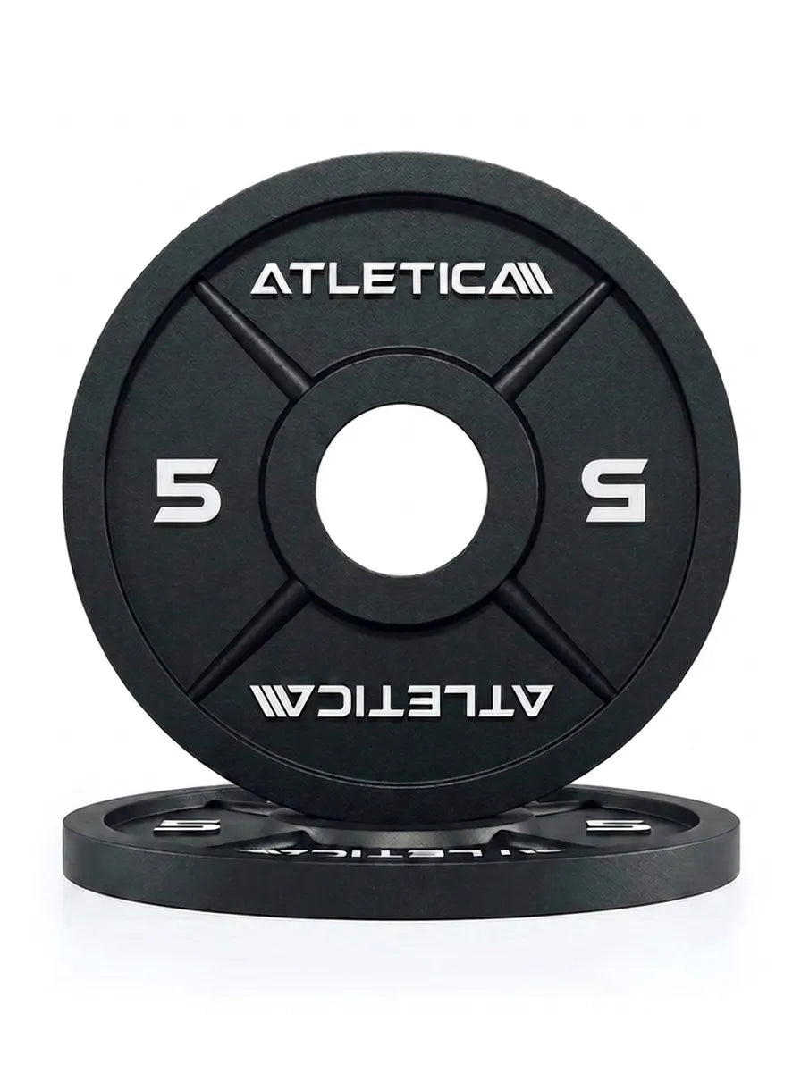 Atletica Iron Plates - two black cast iron weight plates, 5 lb, one standing, one lying flat