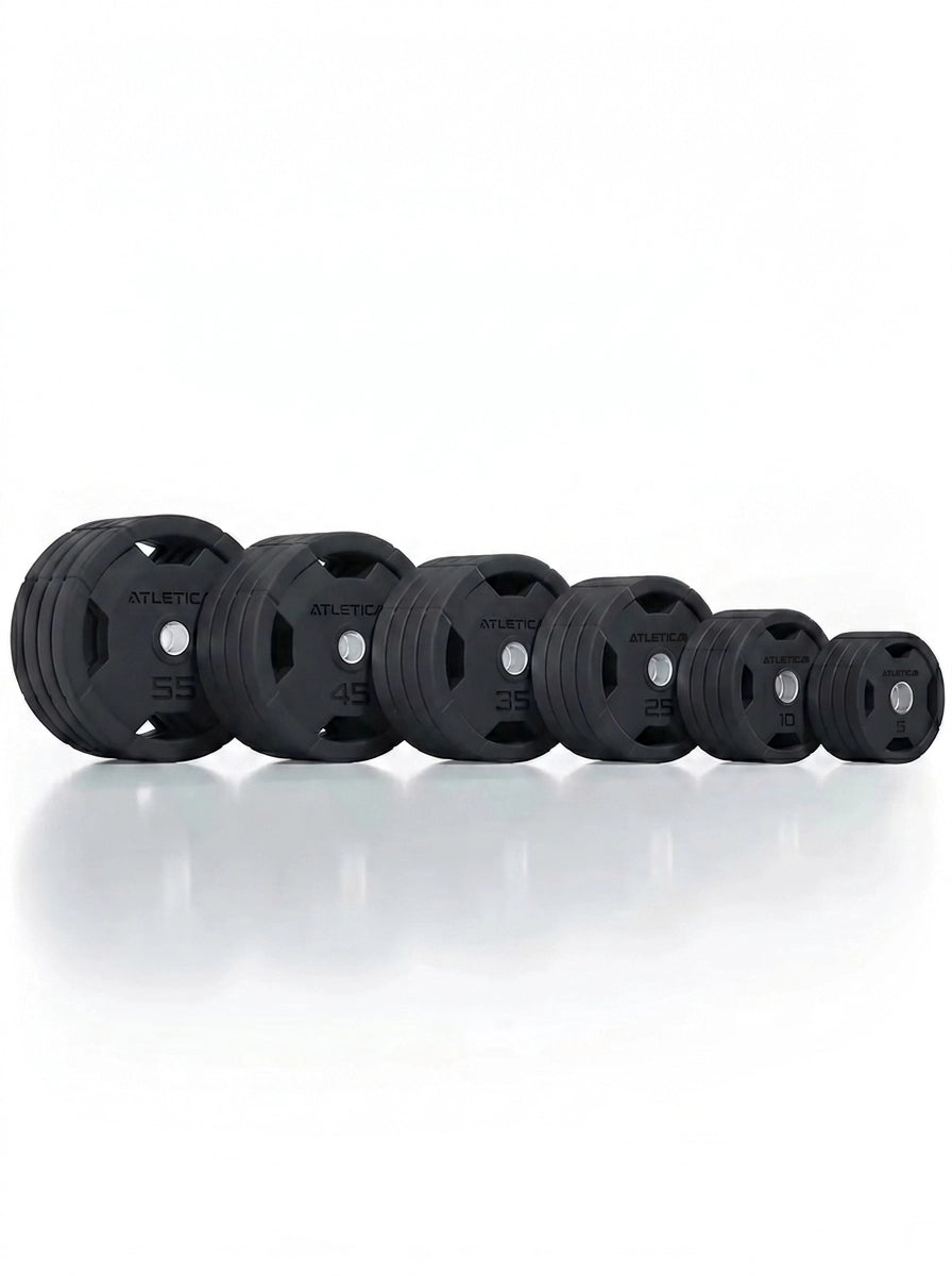 Atletica 4H gripper plates set 700 lb, row of black plates from large to small, low front view