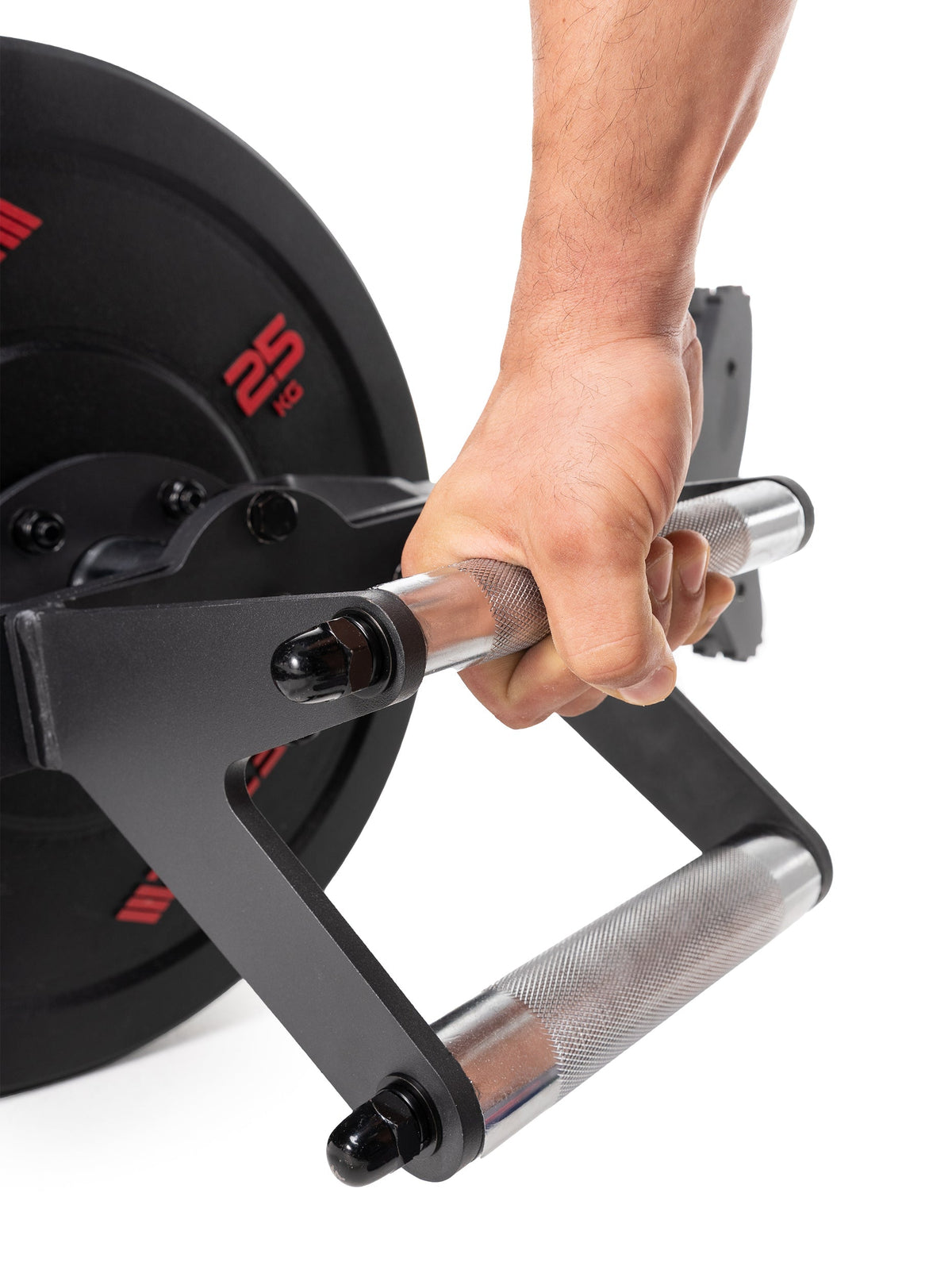 Open Hex Bar - hand gripping handle of the specialty barbell, loaded with 55 lb High Temp weight plates