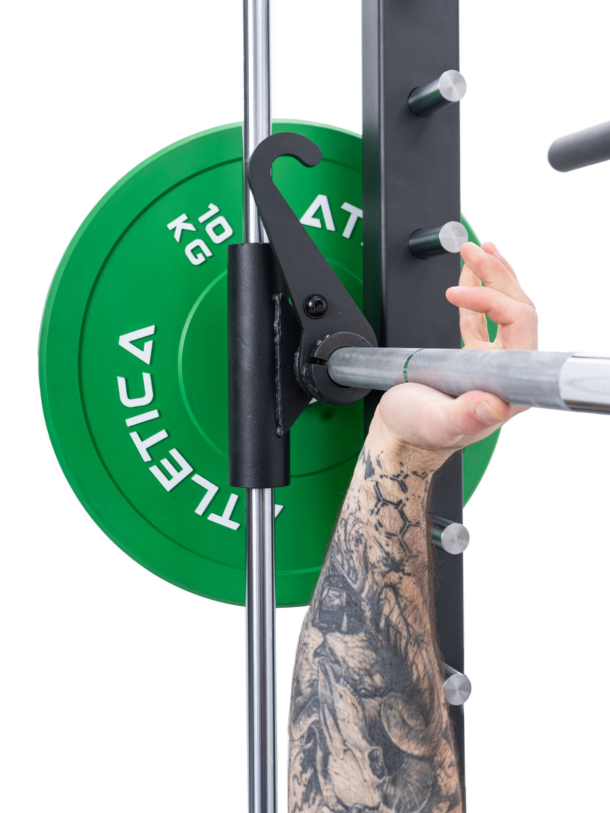 Hand racking the Smith bar on the Atletica R8 Bradley electric green rack, close-up of the bar hook