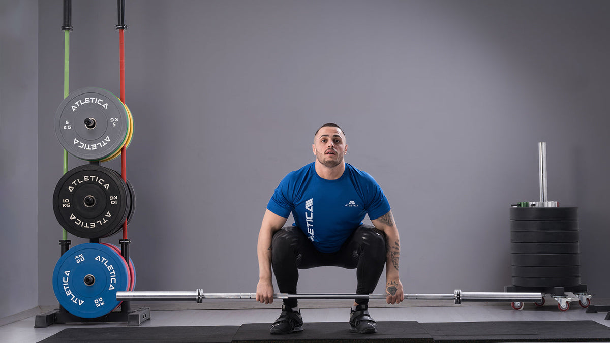 Karlos Nasar deadlifting in the gym with the Atletica barbell