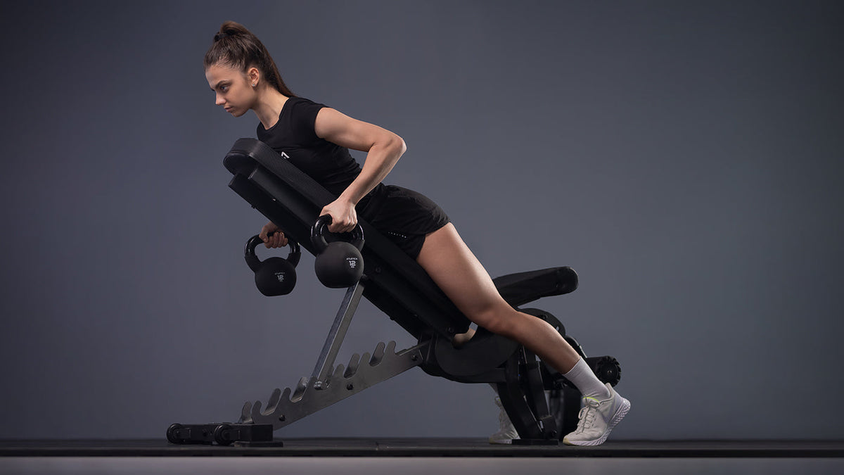 Rows with kettlebells on the adjustable weight bench