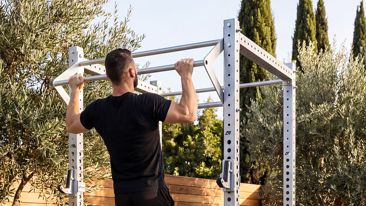 Athlete doing pull-ups on the R8 Magma stainless steel outdoor Power Rack