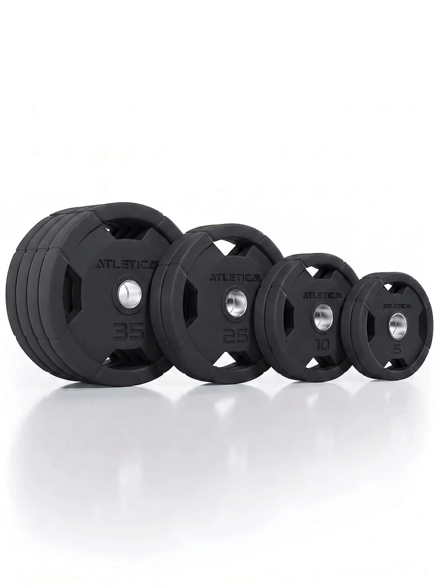 Atletica 4H Gripper plates set 240 lb, plates standing in a row from large to small