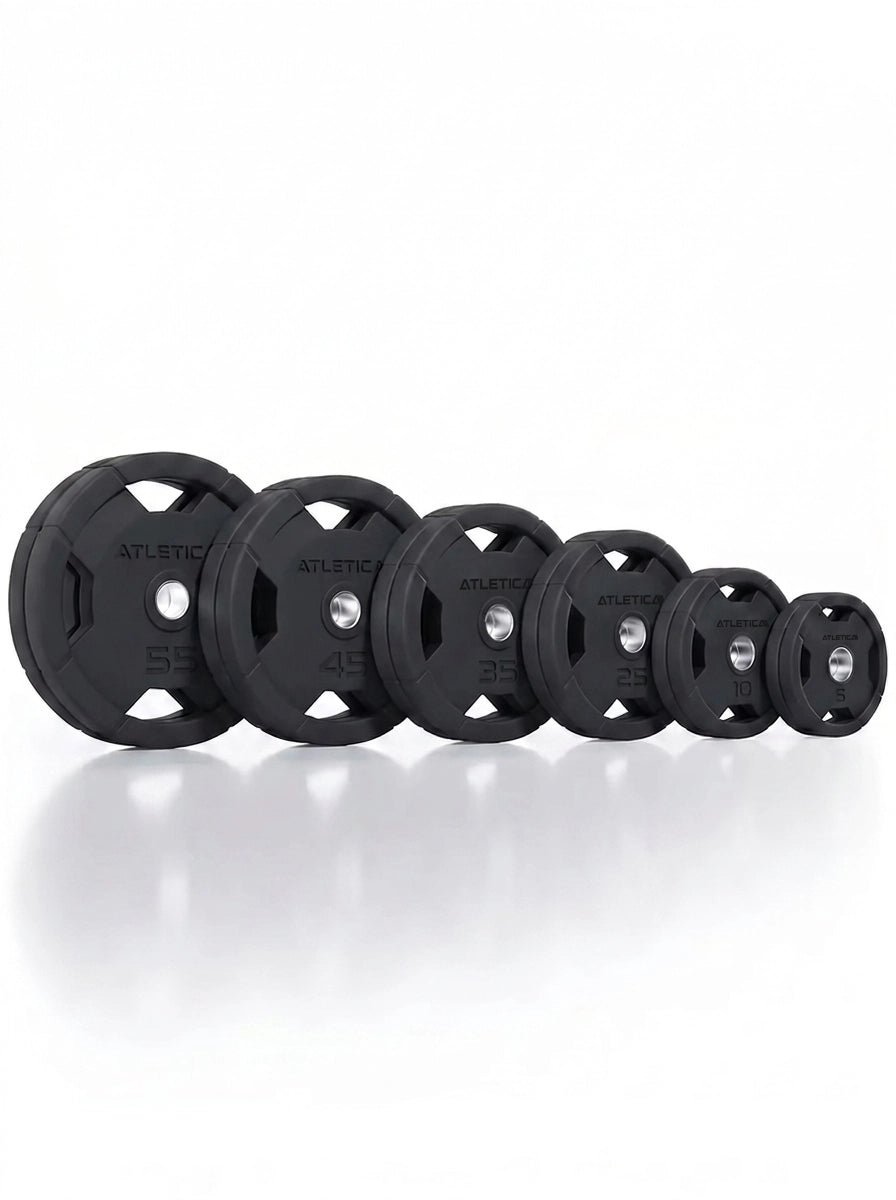 Atletica 4H gripper plates set 350 lb, plates standing side by side from large to small