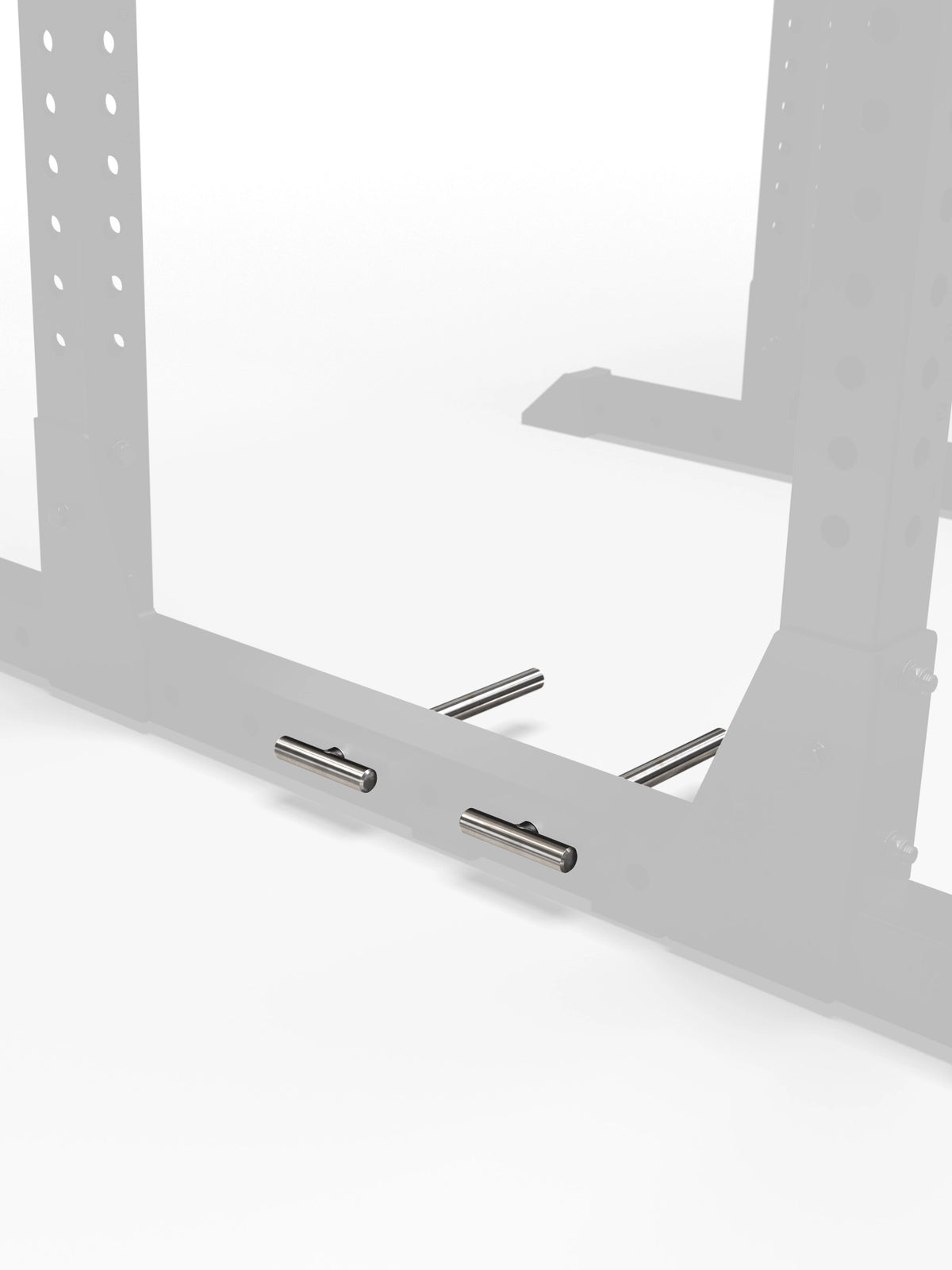 Atletica R7 band pegs installed in the base of a power rack, front angled view