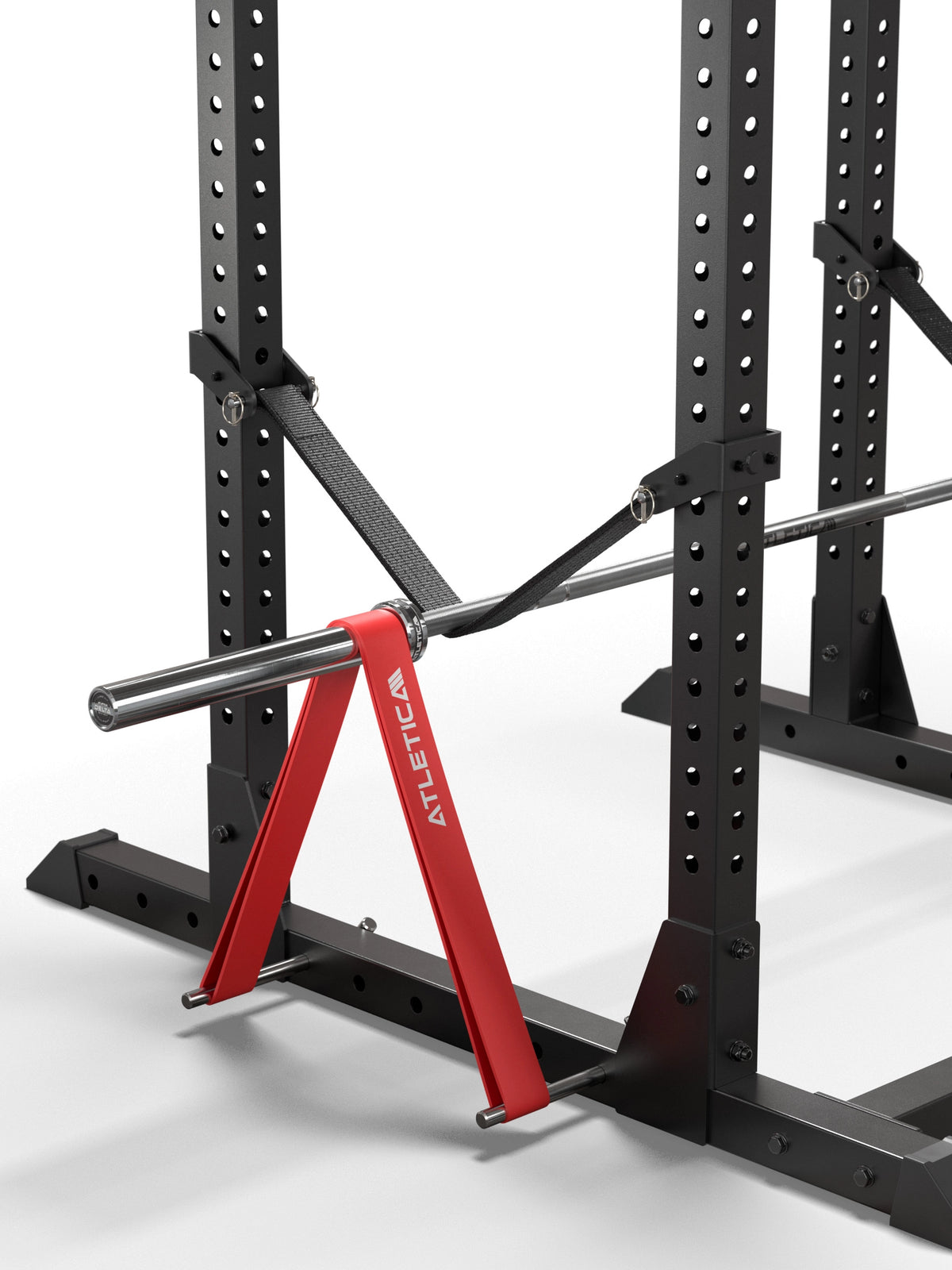 Atletica R7 band pegs with red resistance band attached to a barbell in a power rack