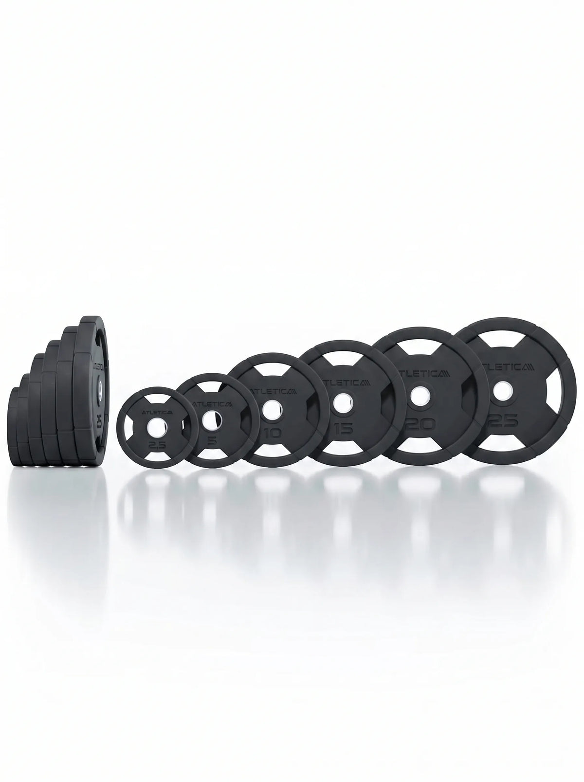 Atletica 4H grip plates in all weights standing in a row with stacked plates behind, side view
