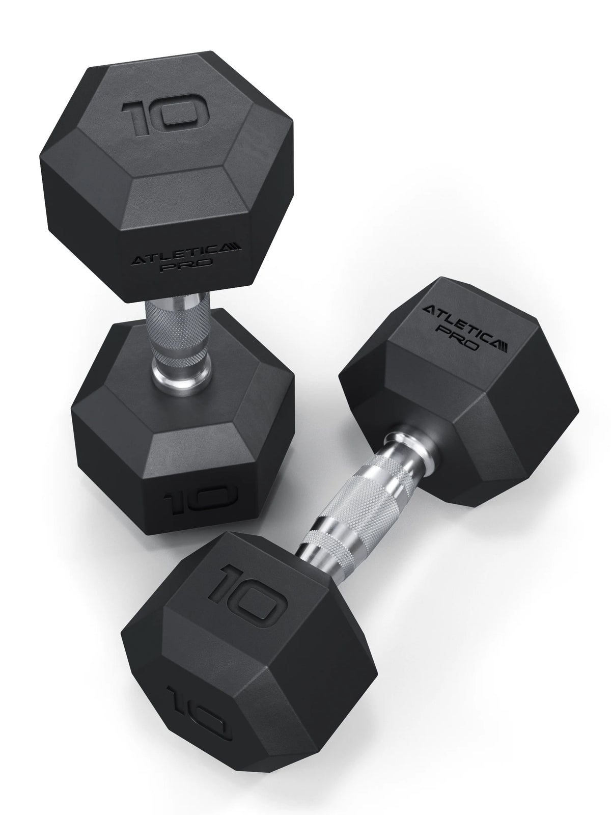 Atletica Hexagon PRO dumbbells 22 lb pair, one upright and one lying tilted, angled top view