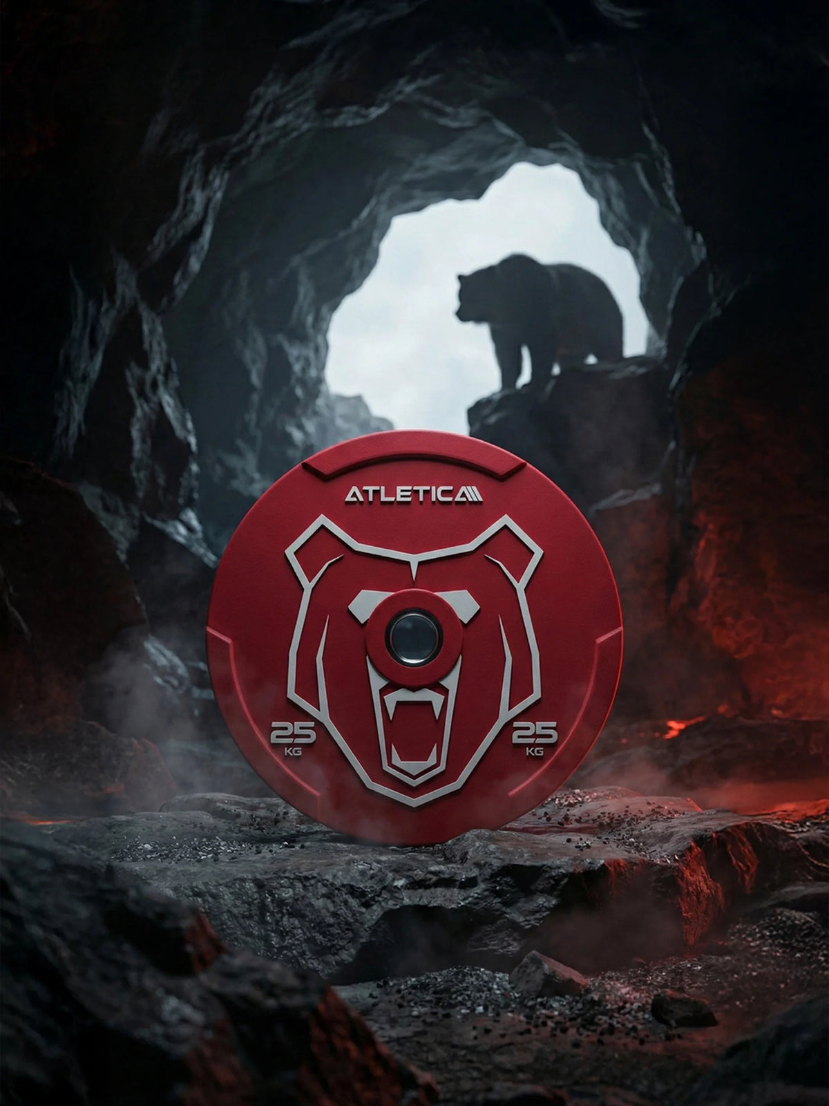 Atletica Animal bumper plate 55 lb, red with bear design, in a dark cave with a bear silhouette