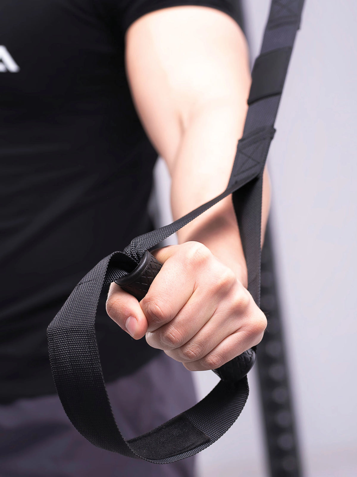 Suspension trainer handle in training as detail