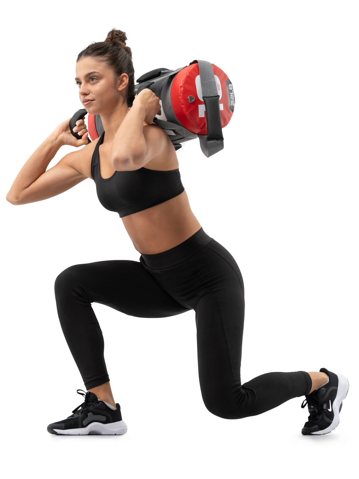 Woman doing lunges with an Atletica power bag on her shoulders