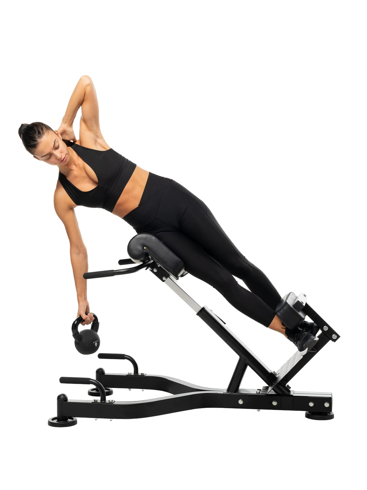 Back extensions with kettlebell on the hyperextension machine