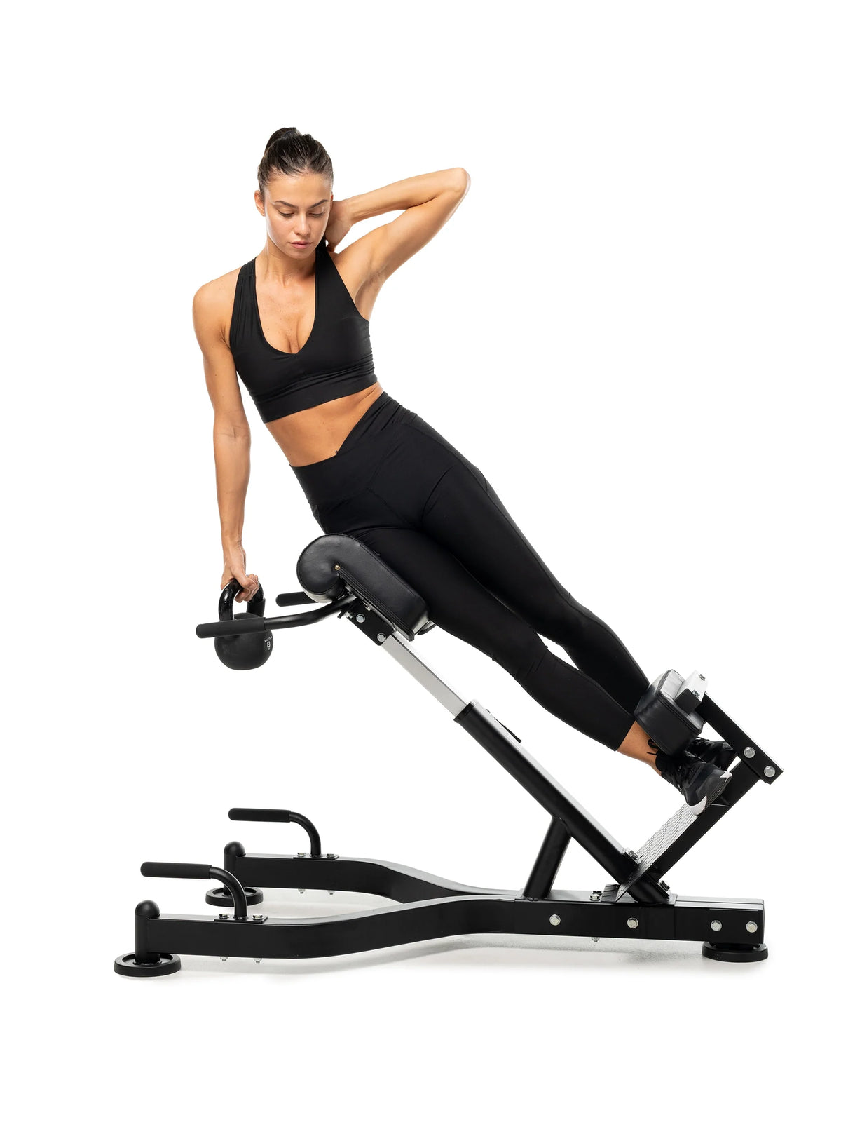 lateral core exercise with kettlebell on the hyperextension machine