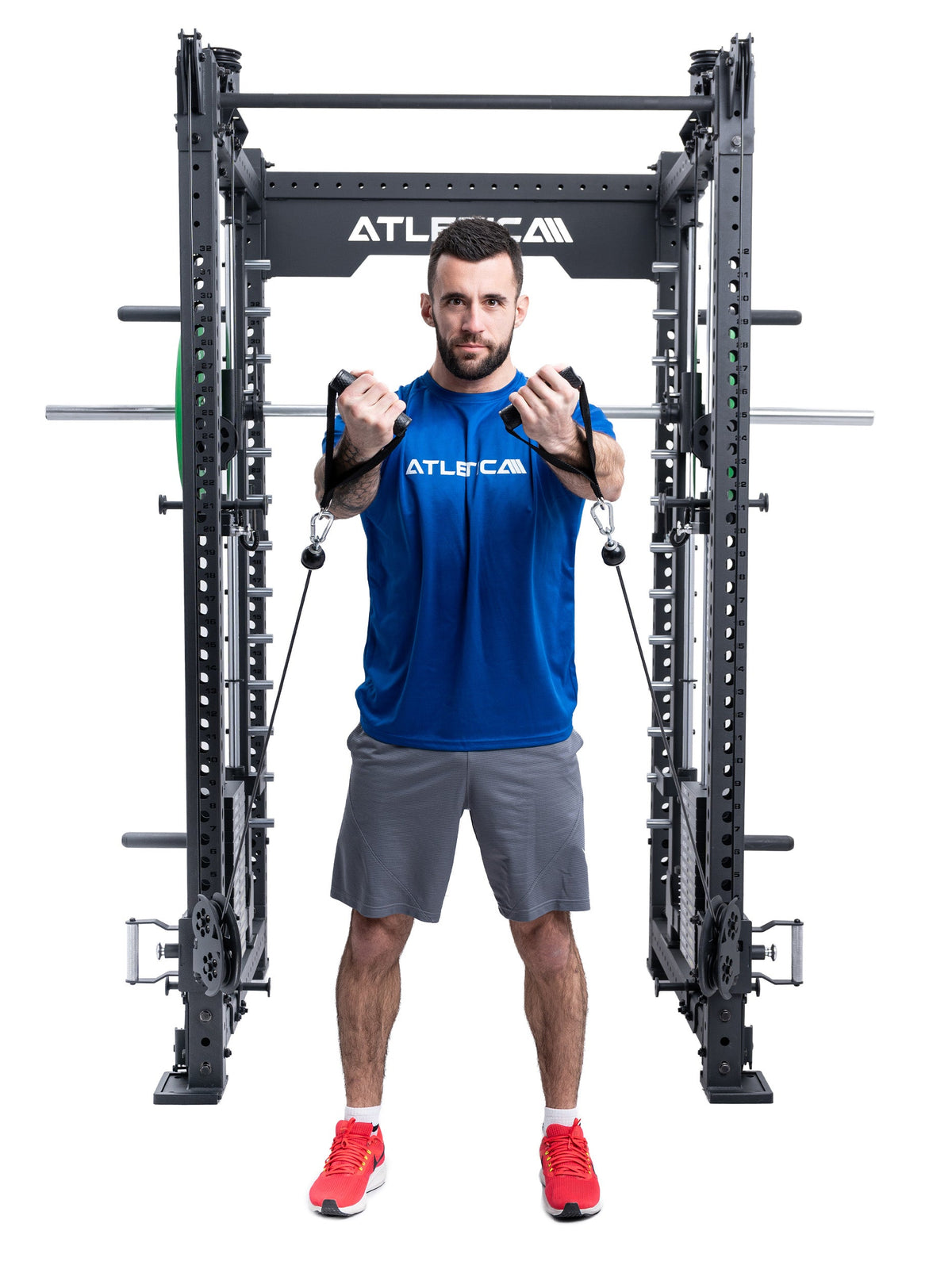 Man doing standing cable chest flys in the Atletica R8 Bradley Short
