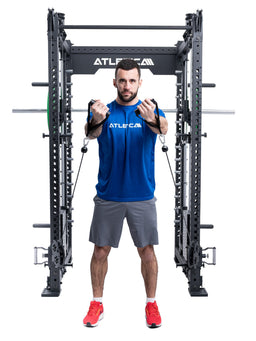Man doing standing cable chest presses in the Atletica R8 Bradley Long power rack