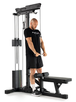 Triceps pushdown on the cable pulley of the lat pulldown station with weight stack and pull handle