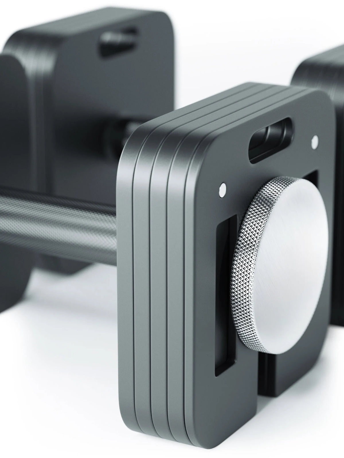 QUAD Adjustable Dumbbell detail view grip structure and adjustment dial close-up