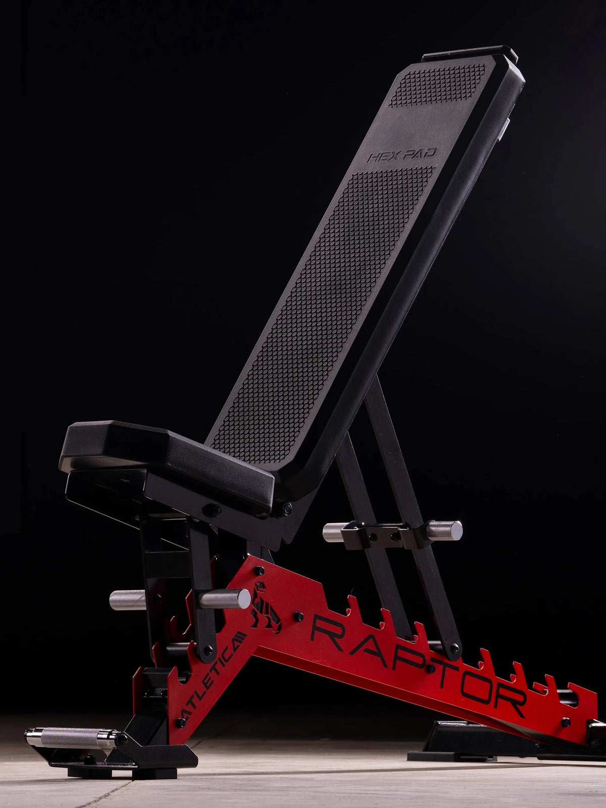 Atletica Raptor HexPad weight bench in sports car red, upright backrest, angled side view