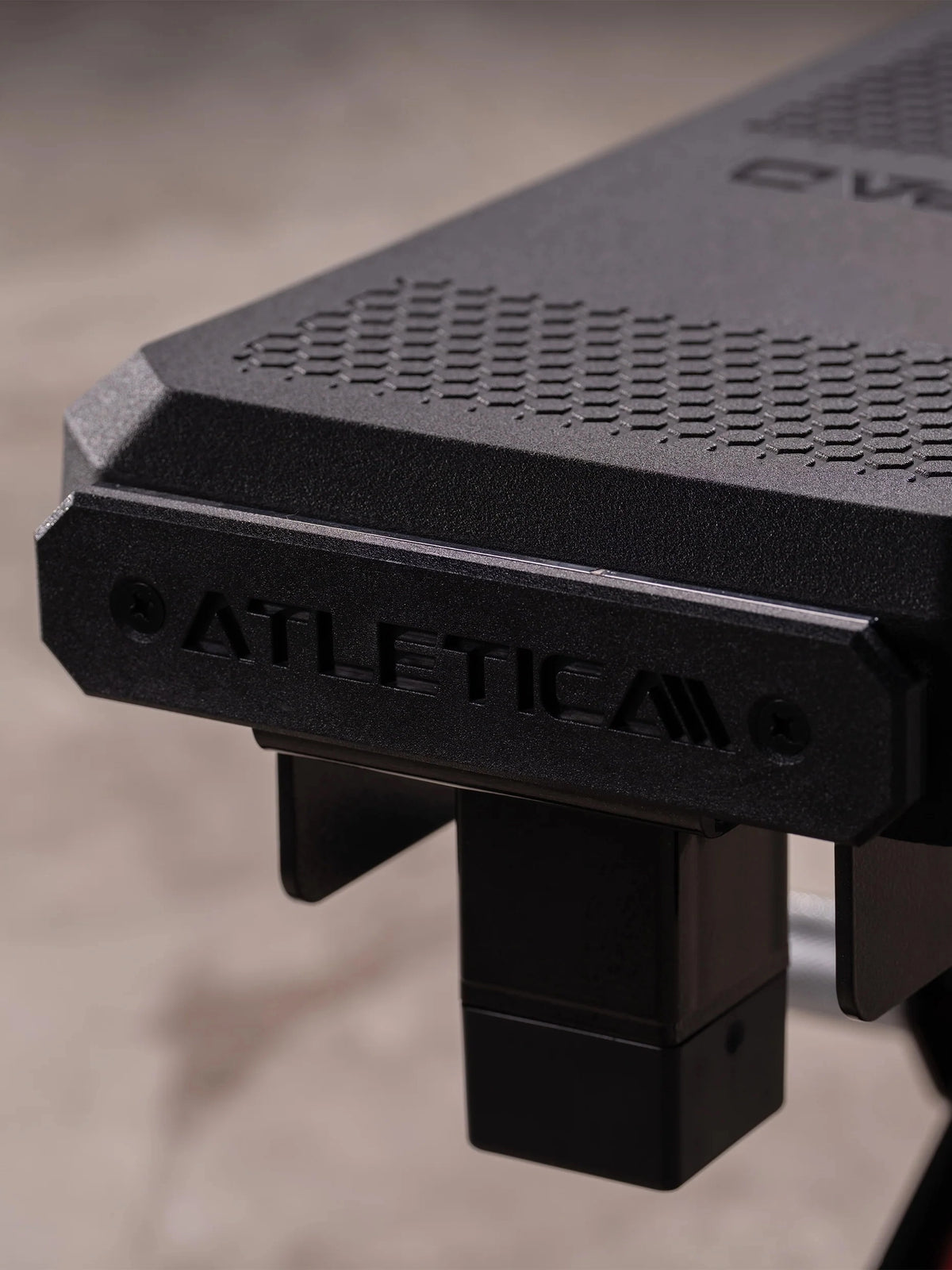 Atletica Raptor HexPad seat, front edge with embossed logo, close-up