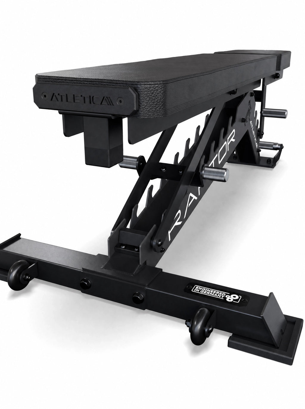 Compact Set Raptor Bench in flat position from a low rear angle, with transport wheels on the steel base