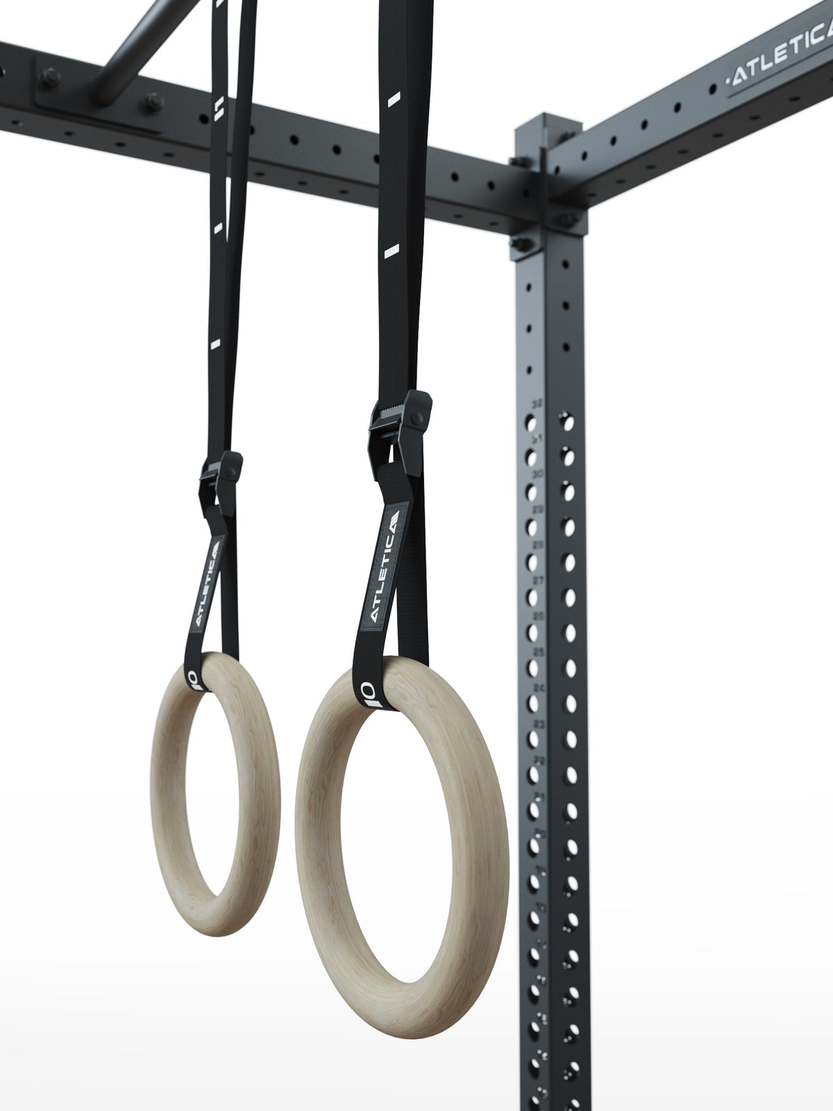 Wooden Gymnastic Rings - two wooden gymnastic rings on black nylon straps, attached to the Power Rack for calisthenics