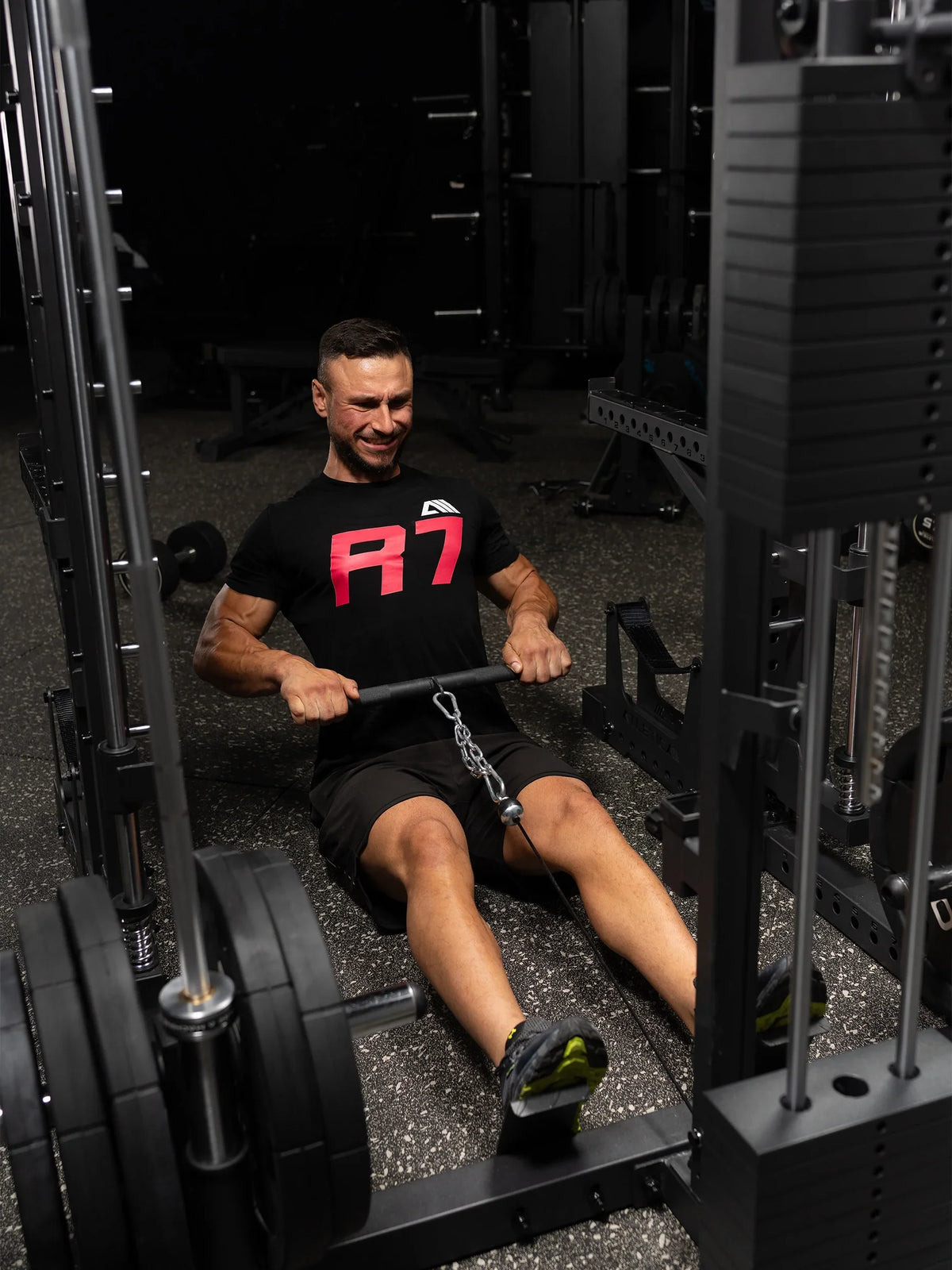 R7 Nemesis Squat Rack - seated rowing at the Lat Pulldown station