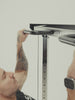 Man doing pull-ups and cable curls on the Atletica Harrier functional trainer, exercise chart detail