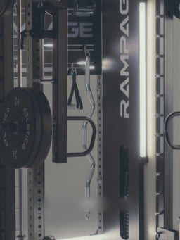 Man doing overhead presses on the Atletica Rampage all-in-one trainer, detail of the frame