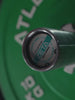 Video: Atletica Zeta short barbell, close-up of the end cap with green bumper plate behind